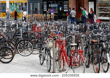 Copenhagen Denmark - August 24 2017: Bikes are parked in a bicycle rack at Norreport in downtown Copenhagen.