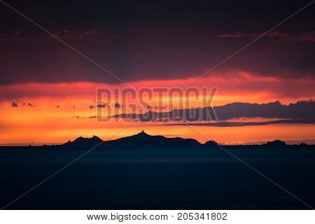 Iles Sanguinaires Silhouetted Against A Dramatic Orange Sunset