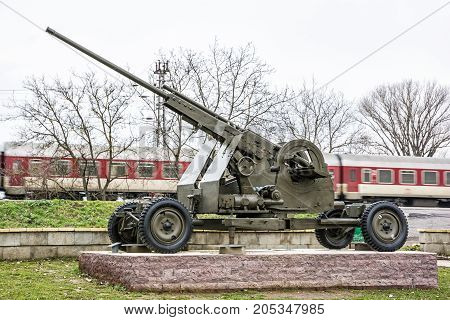 Anti-aircraft machine gun of the World war II. War industry. Personal train in motion. Weapons theme. Exposed artillery.