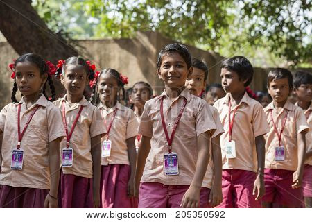 PONDICHERY PUDUCHERY INDIA - SSEPTEMBER 04 2017. School parade of each monday morning with children students in uniforms. They walk sing and pray before going in the classrooms.