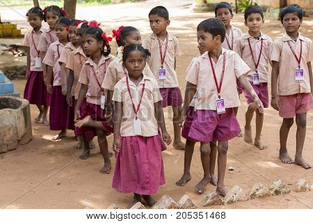 PONDICHERY PUDUCHERY INDIA - SSEPTEMBER 04 2017. School parade of each monday morning with children students in uniforms. They walk sing and pray before going in the classrooms.