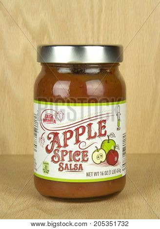 RIVER FALLS,WISCONSIN-SEPTEMBER 23,2017: A jar of Apple Spice salsa with a wood background.