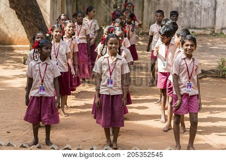 PONDICHERY PUDUCHERY INDIA - SSEPTEMBER 04 2017. School parade of each monday morning with children students in uniforms. They walk sing and pray before going in the classrooms.