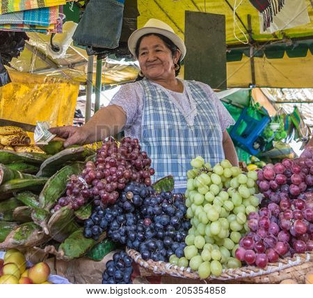 Woman Selling Fruits At Tienda (market)