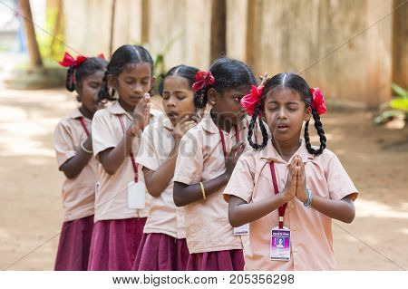 PONDICHERY PUDUCHERY INDIA - SSEPTEMBER 04 2017. School parade of each monday morning with children students in uniforms. They walk sing and pray before going in the classrooms.