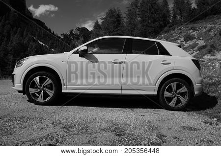 Kranjska Gora, Slovenia - August 11, 2017: Yellow Audi A3 4wd parked by the side of the road. Nobody in de vehicle.