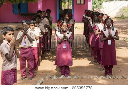 PONDICHERY PUDUCHERY INDIA - SSEPTEMBER 04 2017. School parade of each monday morning with children students in uniforms. They walk sing and pray before going in the classrooms.