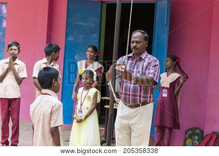PONDICHERY PUDUCHERY INDIA - SSEPTEMBER 04 2017. School parade of each monday morning with children students in uniforms. They walk sing and pray before going in the classrooms.