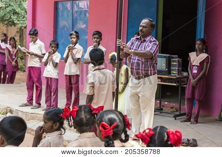 PONDICHERY PUDUCHERY INDIA - SSEPTEMBER 04 2017. School parade of each monday morning with children students in uniforms. They walk sing and pray before going in the classrooms.