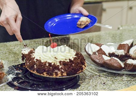 Hand Cutting Warm Whipped Cream Chocolate Pie