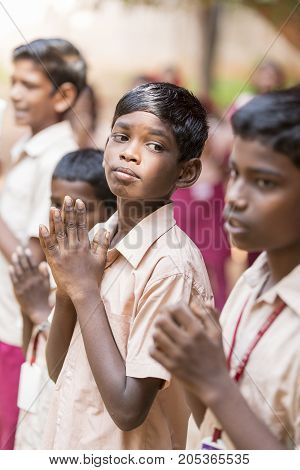 PONDICHERY PUDUCHERY INDIA - SSEPTEMBER 04 2017. School parade of each monday morning with children students in uniforms. They walk sing and pray before going in the classrooms.