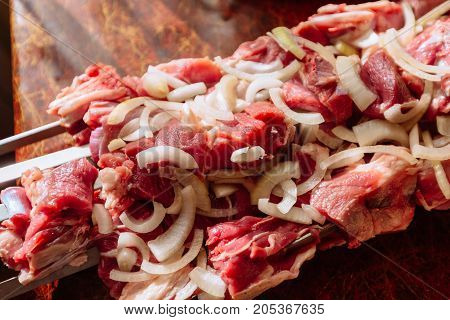 Meat for shish kebab on the kitchen table close up