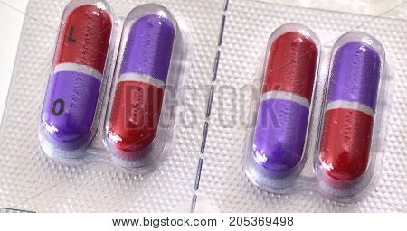 Pills for medical treatment. Pharmaceutical type images showing a verity of pills / capsules.