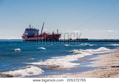 MISSISSAUGA, CANADA - OCTOBER 10 2016: The oil and chemical products tanker Adfines Sea is docked at the Suncor Energy lubricants plant on Lake Ontario.