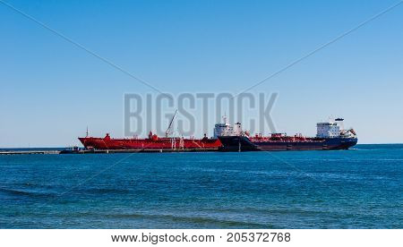 MISSISSAUGA, CANADA - OCTOBER 10 2016: Two tanker ships are docked at the Suncor Energy lubricants plant on the northern shore of Lake Ontario.