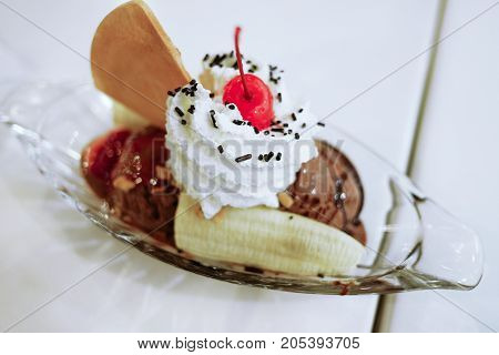 Chocolate ice cream and banana in cup. Sundea ice cream.