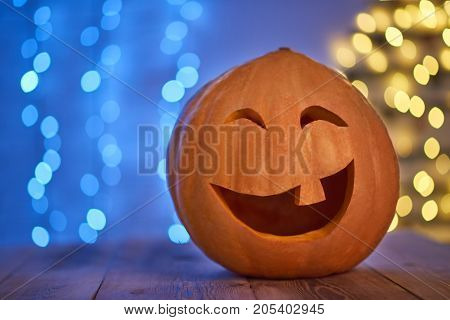 Shot of a Halloween pumping with a laughing face placed on the table copyspace celebrating autumn vegetable traditional tradition.