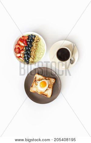 Healthy breakfast preparation on on White wooden background top view