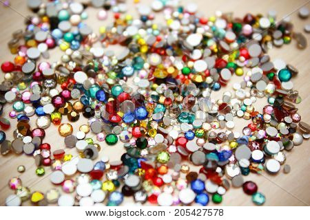 Rhinestone background. Mix of Shiny rhinestones crystals texture as backdrop isolated white studio photo.