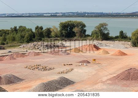Stockyard of quarries sands pebbles and aggregates along river Seine near Le Havre France