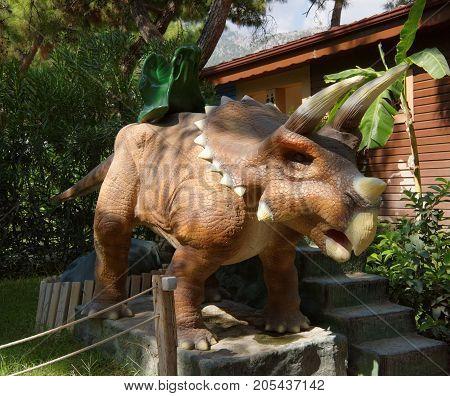Kemer;Turkey- September 06; 2017: Baby mechanical swing-dinosaurs. In the Dinopark