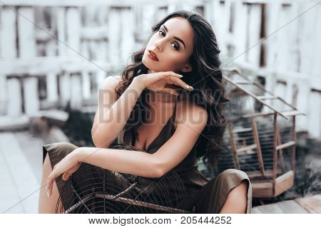 Beautiful fashion model Woman with hair, red lipstick . Portrait of glamour girl with bright makeup. Beauty female face close up with perfect make up