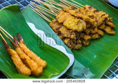 Shrimp satay and prok satay (Thai food style)