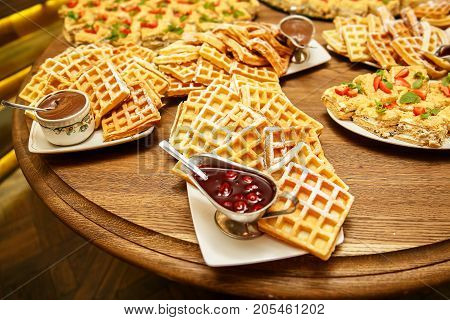 Viennese waffles with jam and chocolate on event catering