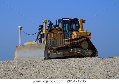 Lelystad, The Netherlands - September 24, 2017: Caterpillar (CAT) D6T LGP bulldozer sits at rest on landwinning construction site Marker Wadden.