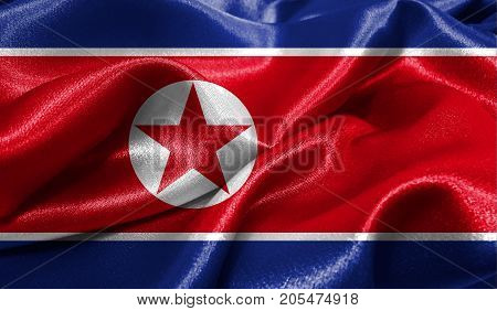 Realistic flag of North Korea on the wavy surface of fabric. This flag can be used in design