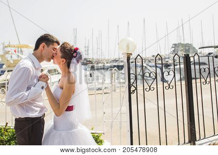 Romantic dating. Young loving couple walking together by the beach enjoying sea.