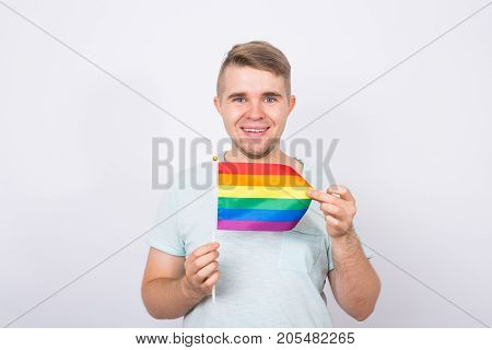 Young man hold a rainbow flag, gey boy.