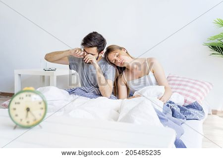 A couple is overslept, they missed the alarm