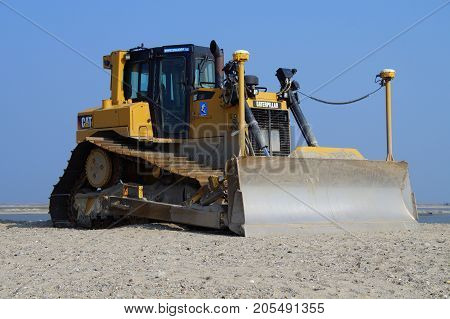 Lelystad, The Netherlands - September 24, 2017: Caterpillar (CAT) D6T LGP bulldozer sits at rest on landwinning construction site Marker Wadden.