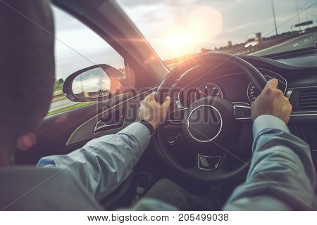 Highway Car Driving. Caucasian Men Behind the Wheel on His Road Trip.