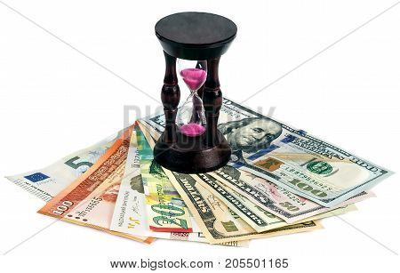 Currency of different countries and hourglass on a white background