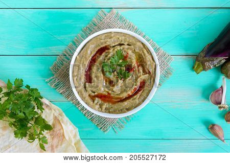 Baba ganush - hummus from eggplant with seasoning parsley. Eastern cuisine.