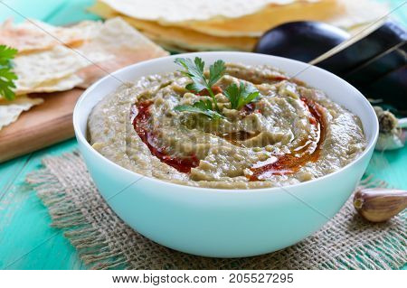 Baba ganush - hummus from eggplant with seasoning parsley. Eastern cuisine.