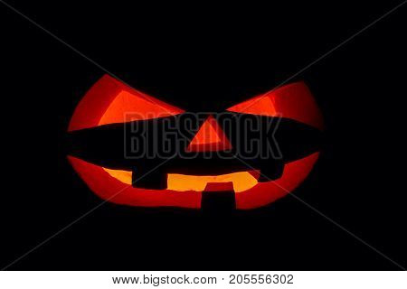 The Concept Of Halloween. The Ghastly, Ghastly Pumpkin Glows With A Fiery Yellow Light. Mystical Jac