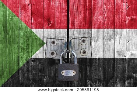 Sudan flag on door with padlock close