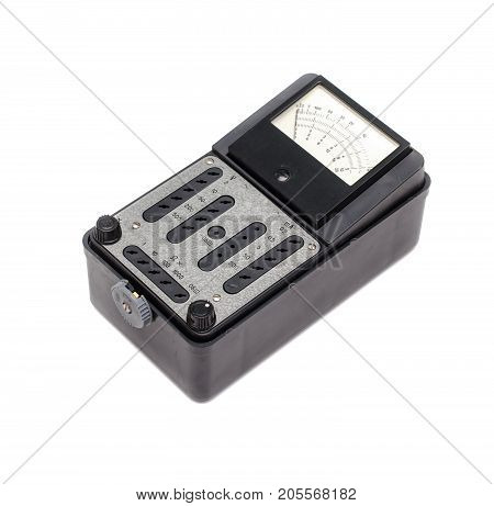 Old retro multimeter isolated on white background. Obsolete technologies.