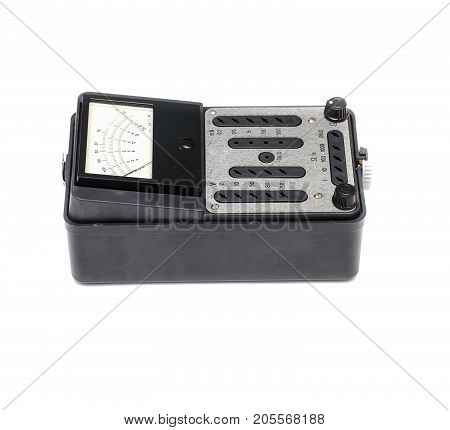 Old retro multimeter isolated on white background. Obsolete technologies.