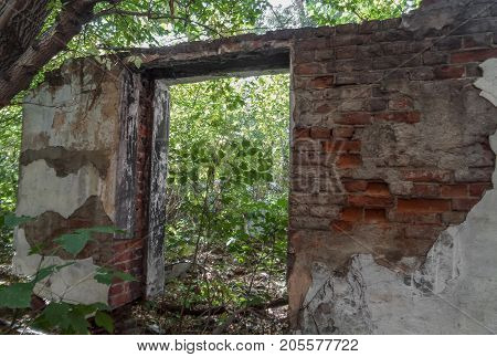 Fragment of the wall of the old destroyed building. Old architecture. Ust-Kamenogorsk. Ruined building