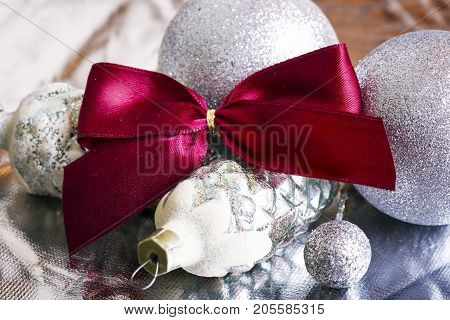 New year silver decoration on briliance background. Top view