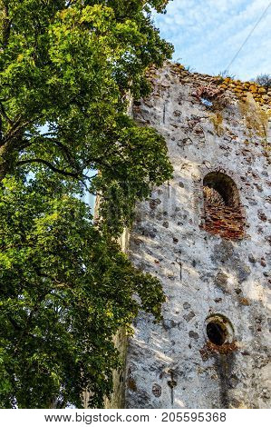 very old Kazdangas church wall of stones.