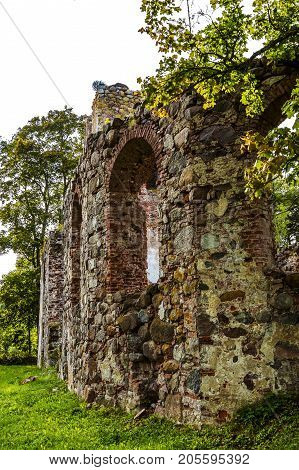 very old Kazdangas church wall of stones.