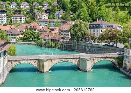 Bern Switzerland - May 26 2016: Architecture of the old European town coastal cityscape with river and bridge in Bern (Unesco Heritage) the capital of Switzerland.