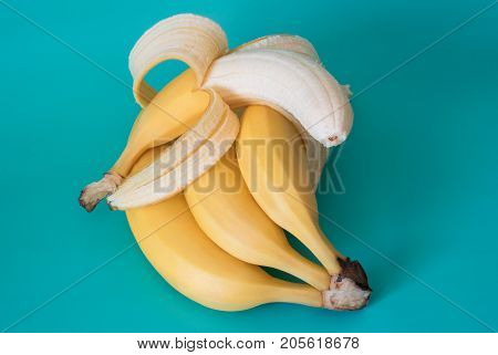 Still life with bananas isolated on colored background