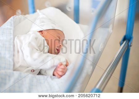Newborn Baby Laying In Crib In Prenatal Hospital