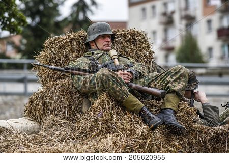 Gryfino Poland 23 september 2017: Historic reconstruction of the battle at Arnhem a soldier resting in a haystack